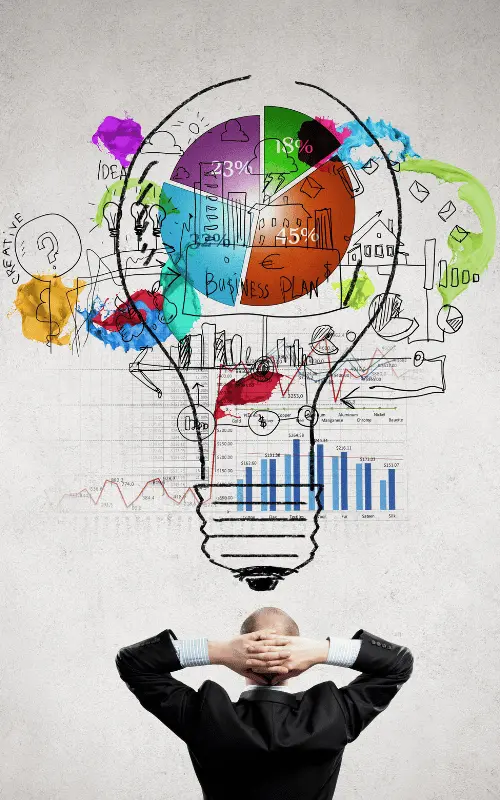 A businessman contemplates a colorful illustration of a lightbulb filled with various charts, graphs, and icons, symbolizing creative and strategic ideas. This image represents the innovative and analytical approach of a digital marketing agency in Ghaziabad.
